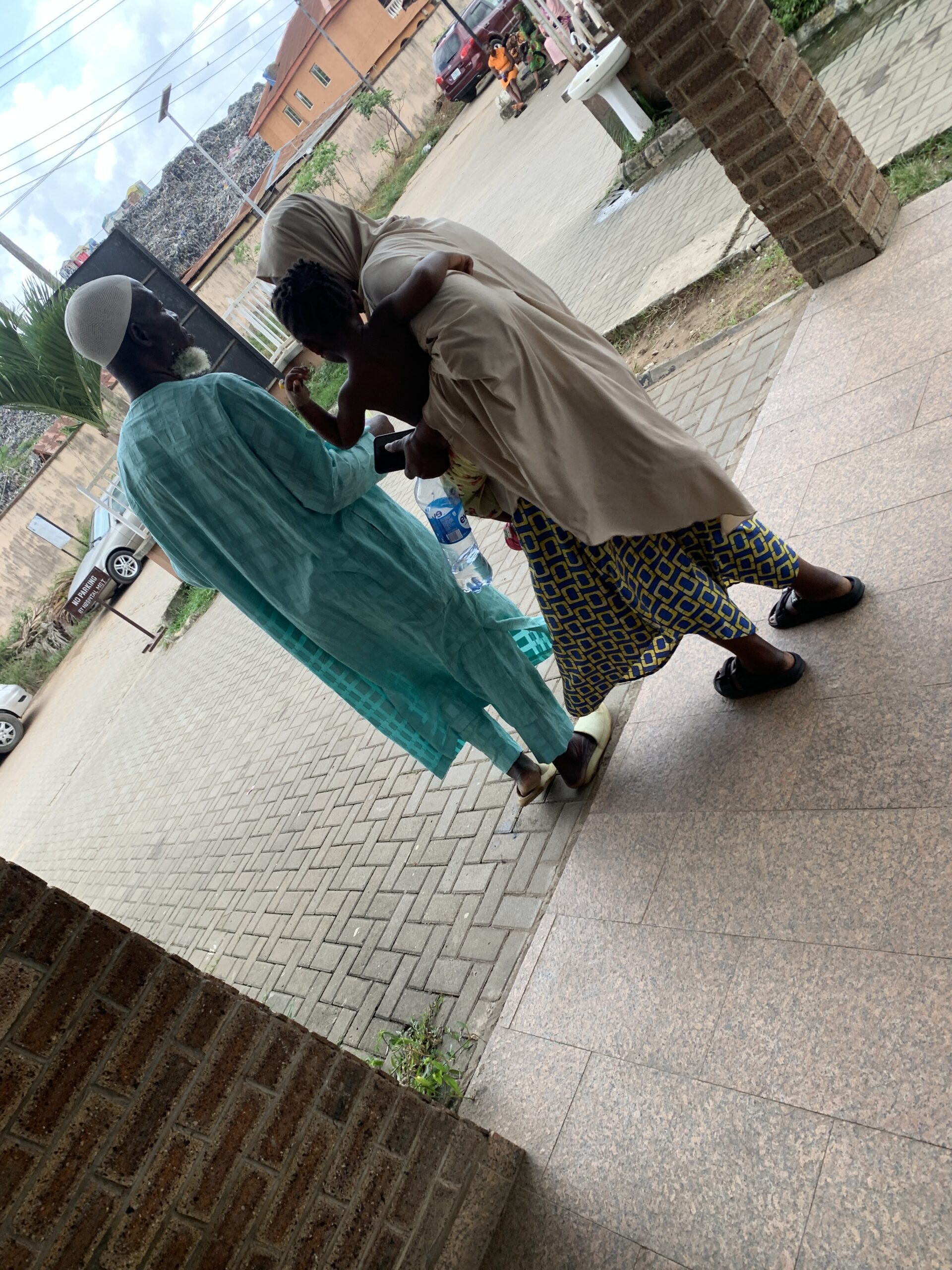 Mr Isiaka and his family leaving the hospital ward
