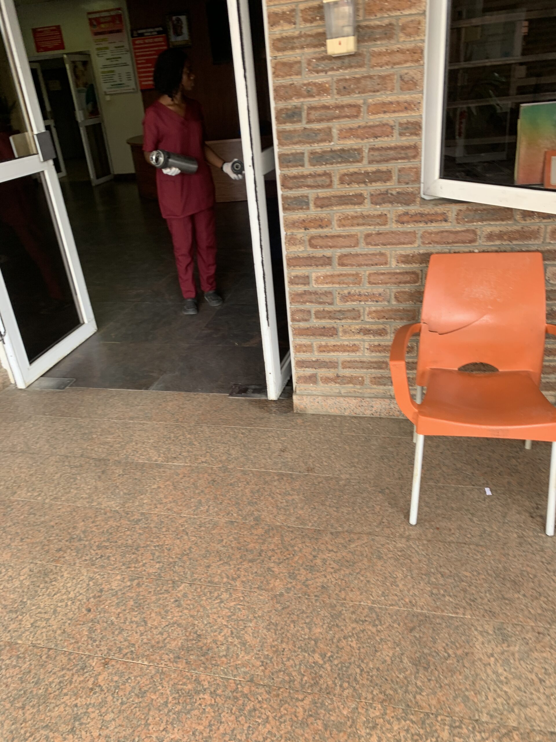 A nurse walking out of the pediatric ward of Alimosho General Hospital