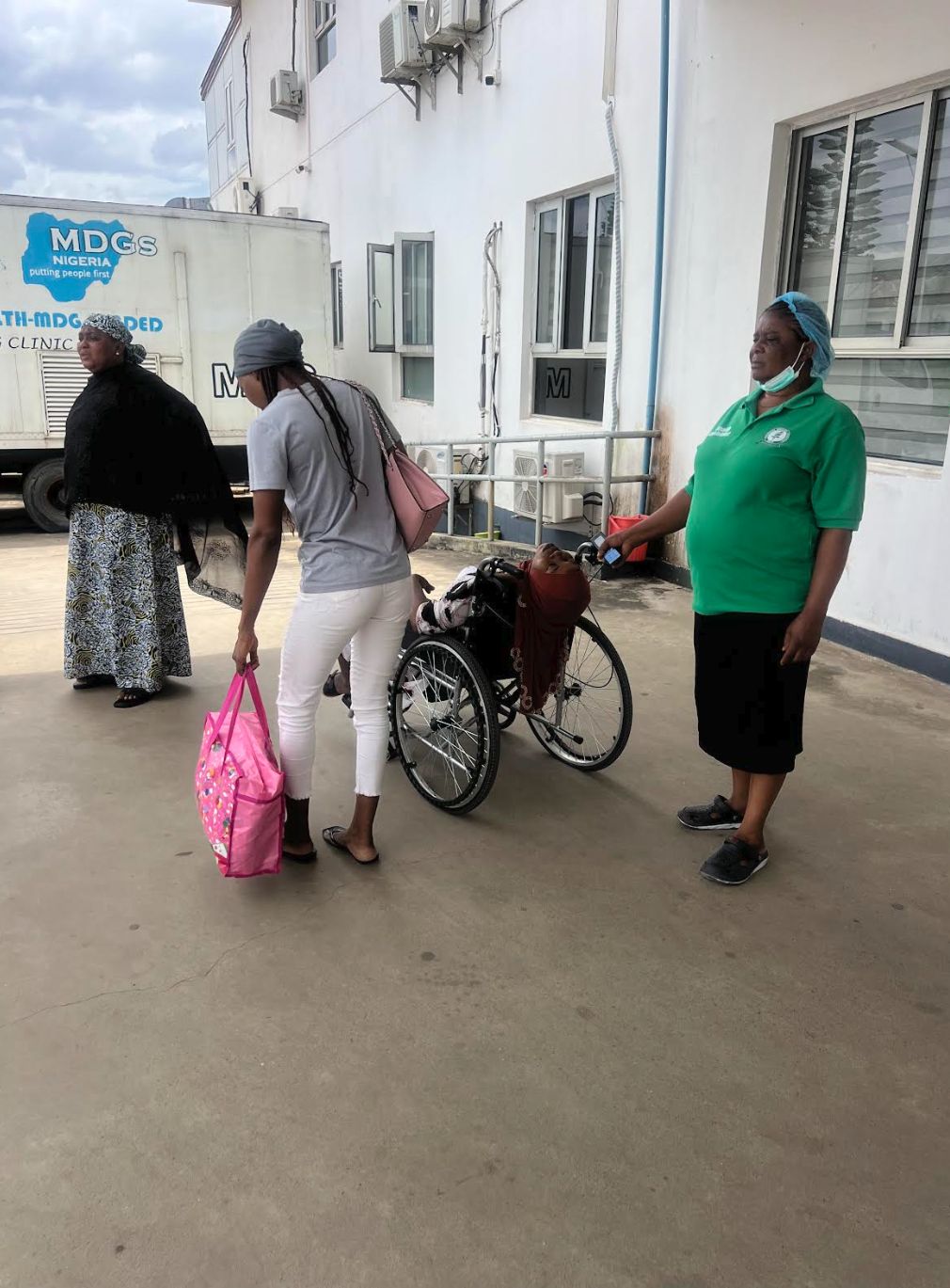 A labouring woman wheeled out of FMC Jabi 